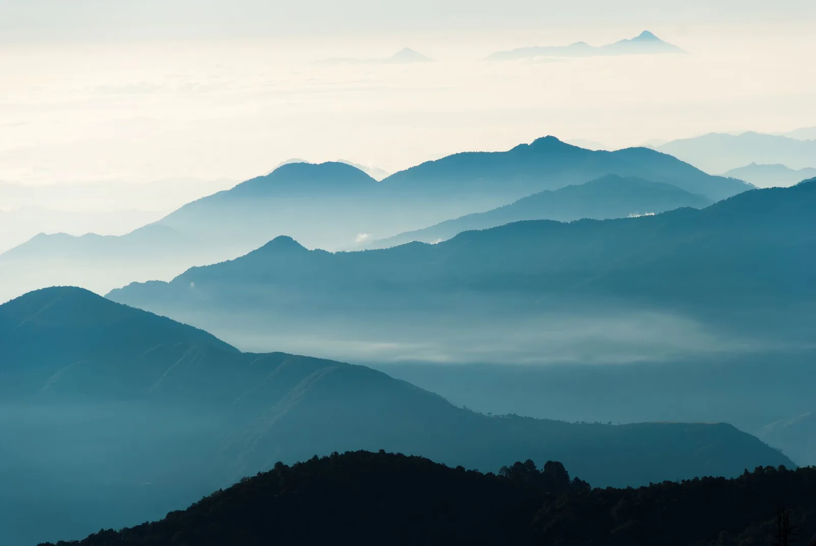 Layers of misty blue mountains fading into the distance